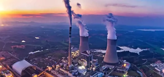 Aerial view of power plant at sunset